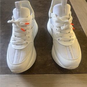 White Sneakers with Orange Accents